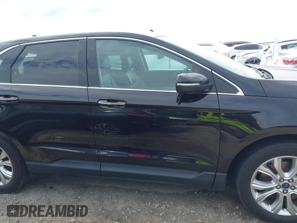 2021 Ford Edge Titanium z VIN 2FMPK3K99MBA16882, wystawiony jako IAAI lot #42214606 z przebiegiem 140 031 mil mil oraz . Historia ofert i sprzedaży dostępna na DreamBid. Obrazek 13.