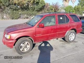 2001 Isuzu Rodeo S with VIN 4S2DM58W814303358, listed as a IAAI auction lot 42695509 with Not provided miles and . Bid and sale history available at DreamBid. Image 6.
