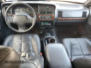 1998 Jeep Grand Cherokee Limited with VIN 1J4GZ78Y1WC124156, listed as a Copart auction lot 77587394 with 176,936 mi miles and Clean Title. Bid and sale history available at carsss.com. Image 8.