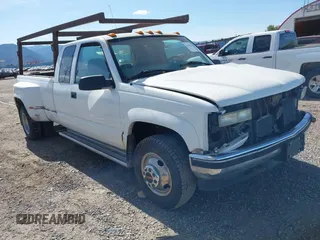 1997 GMC Sierra 3500 z VIN 1GTHK39F4VF020228, wystawiony jako IAAI lot #42164276 z przebiegiem 132 019 mil mil oraz . Historia ofert i sprzedaży dostępna na DreamBid. Obrazek 1.