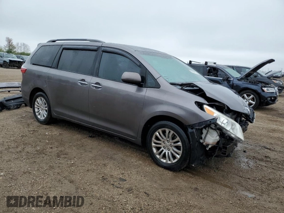 2015 Toyota Sienna XLE with VIN 5TDYK3DC9FS552119, listed as a Copart auction lot 55424515 with 108,307 mi miles and Salvage title. Bid and sale history available at DreamBid. Image 4.