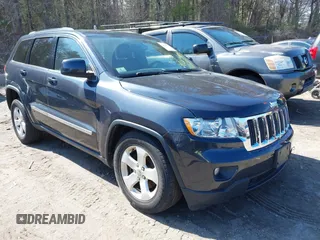 2013 Jeep Grand Cherokee Laredo with VIN 1C4RJFAG1DC592371, listed as a IAAI auction lot 42064993 with 136,154 mi miles. Bid and sale history available at carsss.com. Image 1.