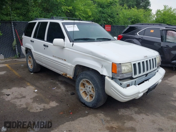 1997 Jeep Grand Cherokee Limited z VIN 1J4GZ78S1VC536295, wystawiony jako IAAI lot #42435292 z przebiegiem 310 005 mil mil oraz . Historia ofert i sprzedaży dostępna na DreamBid. Obrazek 1.