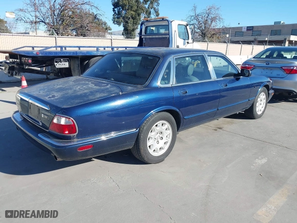 2000 Jaguar XJ with VIN SAJDA14C4YLF16529, listed as a IAAI auction lot 41387819 with 90,143 mi miles. Bid and sale history available at carsss.com. Image 4.