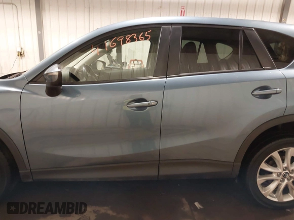 2015 Mazda CX-5 Grand Touring with VIN JM3KE4DY7F0504398, listed as a IAAI auction lot 41698365 with 122,121 mi miles. Bid and sale history available at carsss.com. Image 14.