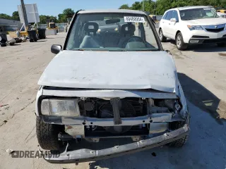 1991 Geo Tracker z VIN 2CNBJ18U3M6909006, wystawiony jako Copart lot #73638944 z przebiegiem 65 033 mil mil oraz Tytuł czysty. Historia ofert i sprzedaży dostępna na DreamBid. Obrazek 5.