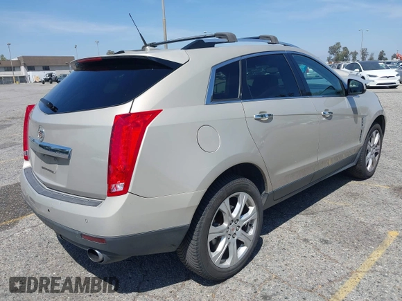 2011 Cadillac SRX Premium Collection z VIN 3GYFNCEY3BS506360, wystawiony jako IAAI lot #42096225 z przebiegiem 173 514 mil mil oraz . Historia ofert i sprzedaży dostępna na DreamBid. Obrazek 4.