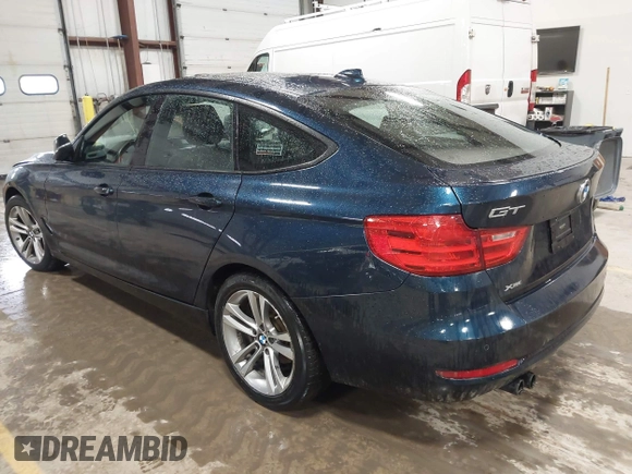 2014 BMW 3 Series 328i Gran Turismo xDrive with VIN WBA3X5C5XED557668, listed as a IAAI auction lot 41728522 with 123,393 mi miles and . Bid and sale history available at DreamBid. Image 3.