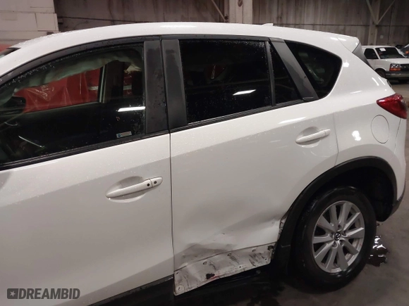 2016 Mazda CX-5 Touring with VIN JM3KE4CY0G0853261, listed as a IAAI auction lot 41861176 with 63,491 mi miles. Bid and sale history available at carsss.com. Image 6.