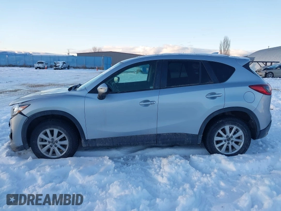 2016 Mazda CX-5 Touring with VIN JM3KE4CY9G0904000, listed as a IAAI auction lot 41186630 with 73,900 mi miles. Bid and sale history available at carsss.com. Image 14.