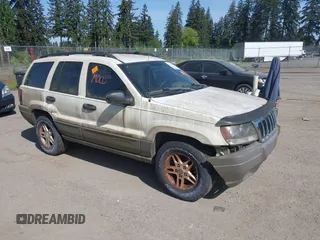 2003 Jeep Grand Cherokee Laredo z VIN 1J4GW48S73C539917, wystawiony jako IAAI lot #42222300 z przebiegiem 230 089 mil mil oraz . Historia ofert i sprzedaży dostępna na DreamBid. Obrazek 1.