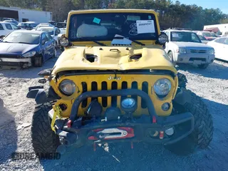 2015 Jeep Wrangler Unlimited Rubicon z VIN 1C4BJWFG4FL681946, wystawiony jako IAAI lot #40809597 z przebiegiem 57 148 mil mil oraz . Historia ofert i sprzedaży dostępna na DreamBid. Obrazek 6.