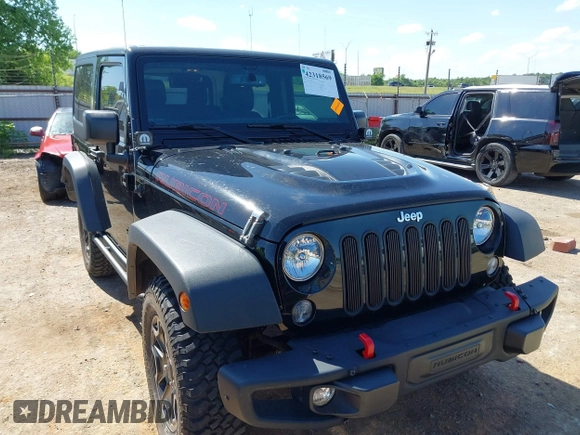 2015 Jeep Wrangler Rubicon Hard Rock with VIN 1C4BJWCG1FL610028, listed as a IAAI auction lot 42318569 with 48,627 mi miles and . Bid and sale history available at DreamBid. Image 12.