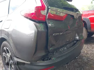 2018 Honda CR-V Touring z VIN 7FARW1H9XJE040530, wystawiony jako IAAI lot #42227446 z przebiegiem 101 299 mil mil oraz . Historia ofert i sprzedaży dostępna na DreamBid. Obrazek 17.