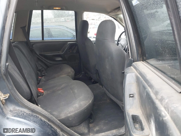 2004 Jeep Grand Cherokee Laredo with VIN 1J4GX48S64C291075, listed as a IAAI auction lot 41805747 with 282,384 mi miles. Bid and sale history available at carsss.com. Image 8.