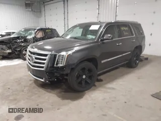 2015 Cadillac Escalade Premium z VIN 1GYS4CKJ8FR308617, wystawiony jako IAAI lot #41974608 z przebiegiem 154 014 mil mil oraz . Historia ofert i sprzedaży dostępna na DreamBid. Obrazek 2.