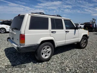 2000 Jeep Cherokee with VIN 1J4FT48S6YL152495, listed as a Copart auction lot 60627965 with 196,086 mi miles and Salvage title. Bid and sale history available at DreamBid. Image 3.