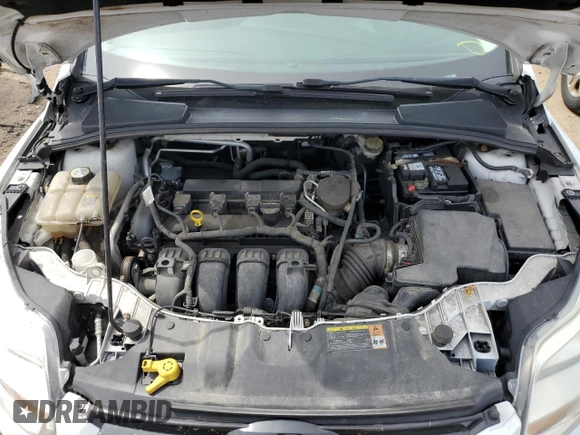 2012 Ford Focus SE z VIN 1FAHP3K27CL256370, wystawiony jako Copart lot #42689255 z przebiegiem 92 641 mil mil oraz Szkoda całkowita • Salvage title. Historia ofert i sprzedaży dostępna na DreamBid. Obrazek 11.
