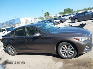 2015 Infiniti Q50 Premium z VIN JN1BV7AR3FM396882, wystawiony jako IAAI lot #37523335 z przebiegiem 89 761 mil mil oraz . Historia ofert i sprzedaży dostępna na DreamBid. Obrazek 12.