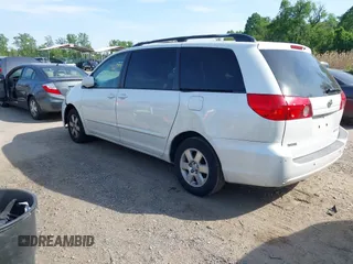 2009 Toyota Sienna XLE with VIN 5TDZK22C19S262107, listed as a IAAI auction lot 42158864 with 186,711 mi miles. Bid and sale history available at carsss.com. Image 3.