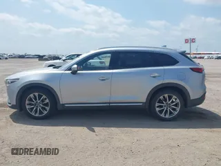 2016 Mazda CX-9 Signature with VIN JM3TCBEY9G0117785, listed as a IAAI auction lot 42331883 with 115,096 mi miles and . Bid and sale history available at DreamBid. Image 14.