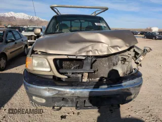 1999 Ford F-150 XL with VIN 1FTRX18L2XKA01348, listed as a Copart auction lot 50087595 with 202,021 mi miles and Salvage Title. Bid and sale history available at carsss.com. Image 5.