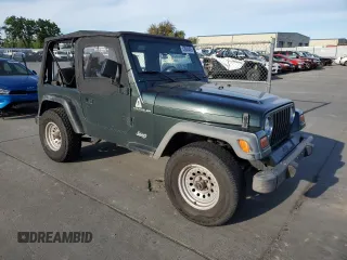 2002 Jeep Wrangler SE z VIN 1J4FA29P72P711802, wystawiony jako Copart lot #52640405 z przebiegiem 107 046 mil mil oraz Czysty tytuł • Clean title. Historia ofert i sprzedaży dostępna na DreamBid. Obrazek 4.
