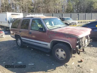 1997 GMC Yukon with VIN 1GKEK13R1VJ702558, listed as a Copart auction lot 85930054 with 165,837 mi miles and Salvage Title. Bid and sale history available at carsss.com. Image 4.
