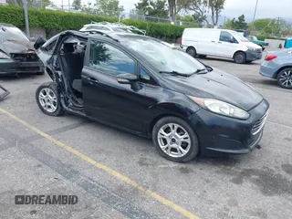 2014 Ford Fiesta SE z VIN 3FADP4BJ0EM216922, wystawiony jako IAAI lot #42255776 z przebiegiem 87 371 mil mil oraz . Historia ofert i sprzedaży dostępna na DreamBid. Obrazek 1.