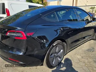 2021 Tesla Model 3 Standard Range Plus with VIN 5YJ3E1EA1MF871146, listed as a Copart auction lot 42027405 with 72,492 mi miles and Salvage Title. Bid and sale history available at DreamBid. Image 4.