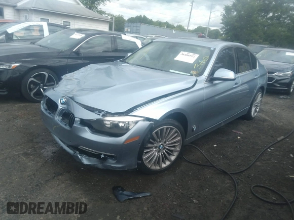 2013 BMW 3 Series 328i with VIN WBA3A5G54DNP25843, listed as a IAAI auction lot 39515836 with 104,045 mi miles. Bid and sale history available at carsss.com. Image 2.