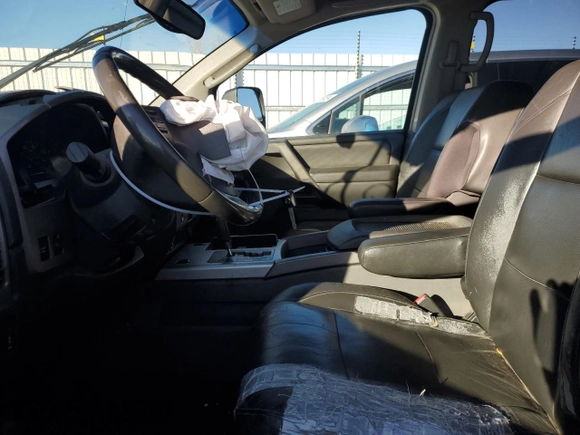 2005 Nissan Titan SE with VIN 1N6AA07B65N566549, listed as a Copart auction lot 80915034 with 268,827 mi miles and Salvage Title. Bid and sale history available at carsss.com. Image 7.