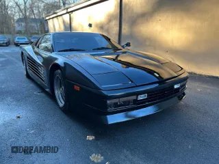 1988 Pontiac Fiero z VIN 1G2PE119XJP213392, wystawiony jako Copart lot #55215415 z przebiegiem 71 246 mil mil oraz Tytuł czysty. Historia ofert i sprzedaży dostępna na DreamBid. Obrazek 1.