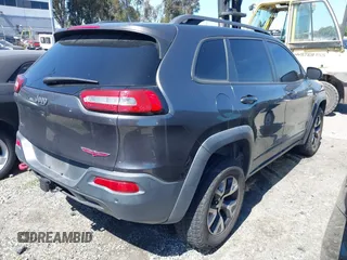 2018 Jeep Cherokee Trailhawk with VIN 1C4PJMBX0JD534722, listed as a IAAI auction lot 41557426 with 109,429 mi miles and . Bid and sale history available at DreamBid. Image 4.