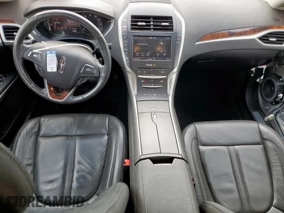 2014 Lincoln MKZ z VIN 3LN6L2G90ER815819, wystawiony jako Copart lot #61189515 z przebiegiem 101 148 mil mil oraz Szkoda całkowita • Salvage title. Historia ofert i sprzedaży dostępna na DreamBid. Obrazek 8.