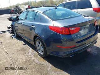 2015 Kia Optima LX with VIN KNAGM4A74F5569738, listed as a IAAI auction lot 41980622 with 161,434 mi miles. Bid and sale history available at carsss.com. Image 3.