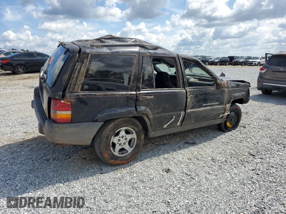 1996 Jeep Grand Cherokee Laredo with VIN 1J4FX58S6TC349590, listed as a Copart auction lot 72278714 with 0 mi miles and Salvage Title. Bid and sale history available at carsss.com. Image 3.
