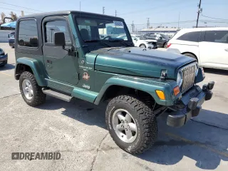 2000 Jeep Wrangler Sahara z VIN 1J4FA59S1YP746043, wystawiony jako Copart lot #58842665 z przebiegiem 148 348 mil mil oraz Szkoda całkowita • Salvage title. Historia ofert i sprzedaży dostępna na DreamBid. Obrazek 4.