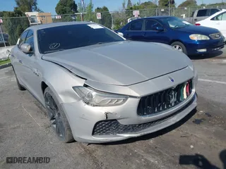 2014 Maserati Ghibli S Q4 with VIN ZAM57RTA8E1095303, listed as a IAAI auction lot 41600587 with 98,215 mi miles. Bid and sale history available at carsss.com. Image 6.