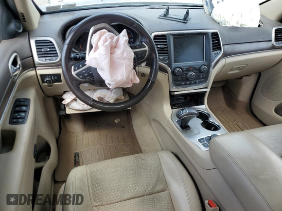 2015 Jeep Grand Cherokee Overland with VIN 1C4RJFCG3FC880084, listed as a Copart auction lot 57291165 with 112,442 mi miles and Salvage title. Bid and sale history available at DreamBid. Image 8.