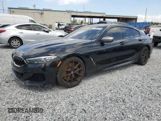 2020 BMW 8 Series M850i z VIN WBAGV8C06LBP48901, wystawiony jako Copart lot #57595725 z przebiegiem 88 332 mil mil oraz Tytuł czysty. Historia ofert i sprzedaży dostępna na DreamBid. Obrazek 1.