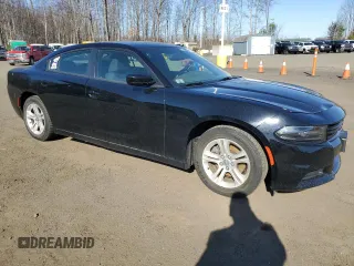 2015 Dodge Charger SE with VIN 2C3CDXBGXFH870769, listed as a Copart auction lot 53486975 with 102,323 mi miles and Salvage Title. Bid and sale history available at carsss.com. Image 4.