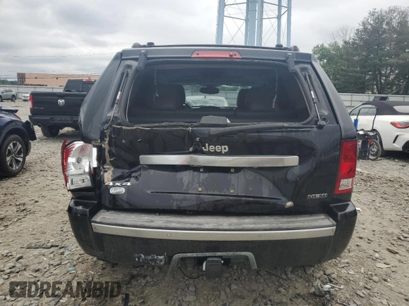 2007 Jeep Grand Cherokee Overland with VIN 1J8HR68227C651830, listed as a Copart auction lot 62403725 with 147,827 mi miles and Salvage title. Bid and sale history available at DreamBid. Image 6.