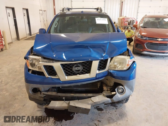 2015 Nissan Frontier SV with VIN 1N6AD0EV4FN709892, listed as a IAAI auction lot 42473594 with 153,103 mi miles and . Bid and sale history available at DreamBid. Image 6.
