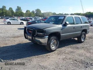 2002 GMC Yukon SLT z VIN 1GKEK13Z42J299221, wystawiony jako IAAI lot #40302959 z przebiegiem 260 096 mil mil oraz . Historia ofert i sprzedaży dostępna na DreamBid. Obrazek 2.