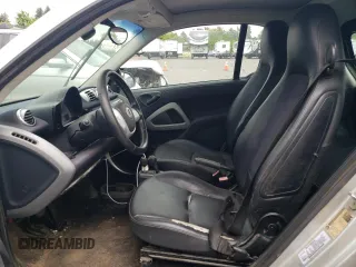 2012 Smart fortwo Pure с VIN WMEEJ3BA1CK573090, выставлен на аукционе Copart как лот 59881025 с пробегом 128 086 миль миль и Чистый • Clean title. История ставок и продаж доступна на DreamBid. Изображение 7.