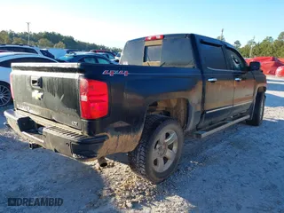 2015 Chevrolet Silverado 1500 LTZ with VIN 3GCUKSEJXFG489780, listed as a IAAI auction lot 41335608 with 140,972 mi miles. Bid and sale history available at carsss.com. Image 4.
