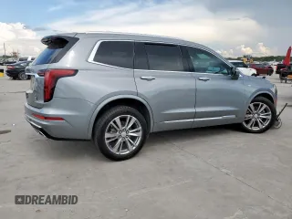 2024 Cadillac XT6 FWD Premium Luxury with VIN 1GYKPCRS7RZ704046, listed as a Copart auction lot 62534055 with 25,644 mi miles and Salvage title. Bid and sale history available at DreamBid. Image 3.