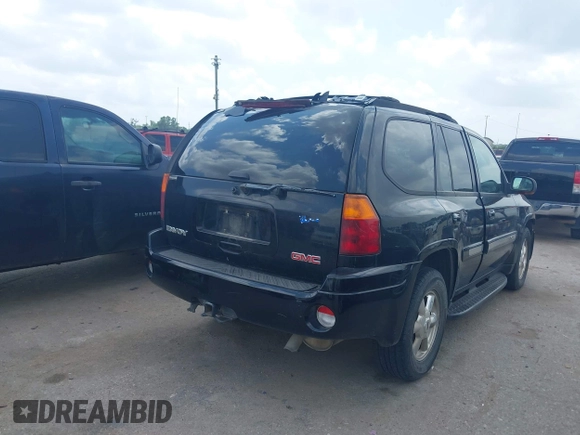 2004 GMC Envoy SLE with VIN 1GKDS13SX42398363, listed as a IAAI auction lot 42154134 with 308,001 mi miles and . Bid and sale history available at DreamBid. Image 4.