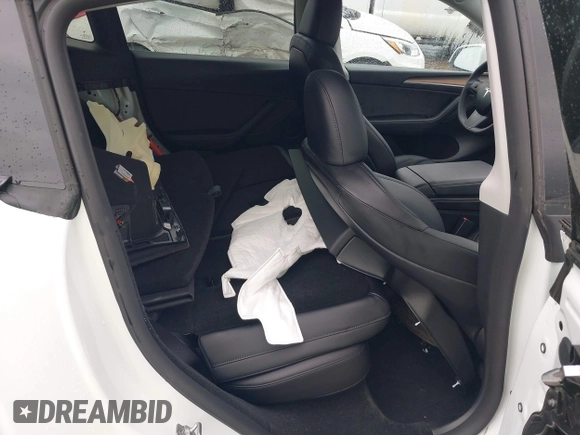 2023 Tesla Model Y Performance with VIN 7SAYGDEF7PF807312, listed as a IAAI auction lot 41711068 with 25,029 mi miles and . Bid and sale history available at DreamBid. Image 8.